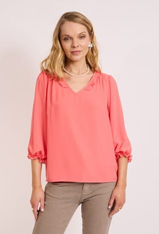 Bluzka damska z falbaną – kobiecy minimalizm